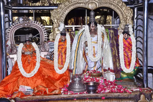 Garlanded murtis of Vishnu as Srinivasa with Sridevi, Bhudevi and Lakshmi