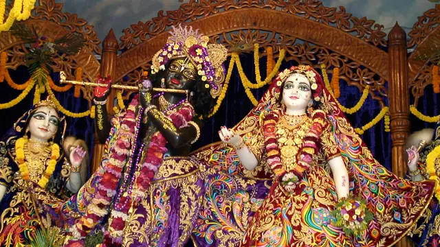Ornately dressed Radha Krishna deities with flute at ISKCON Mayapur temple